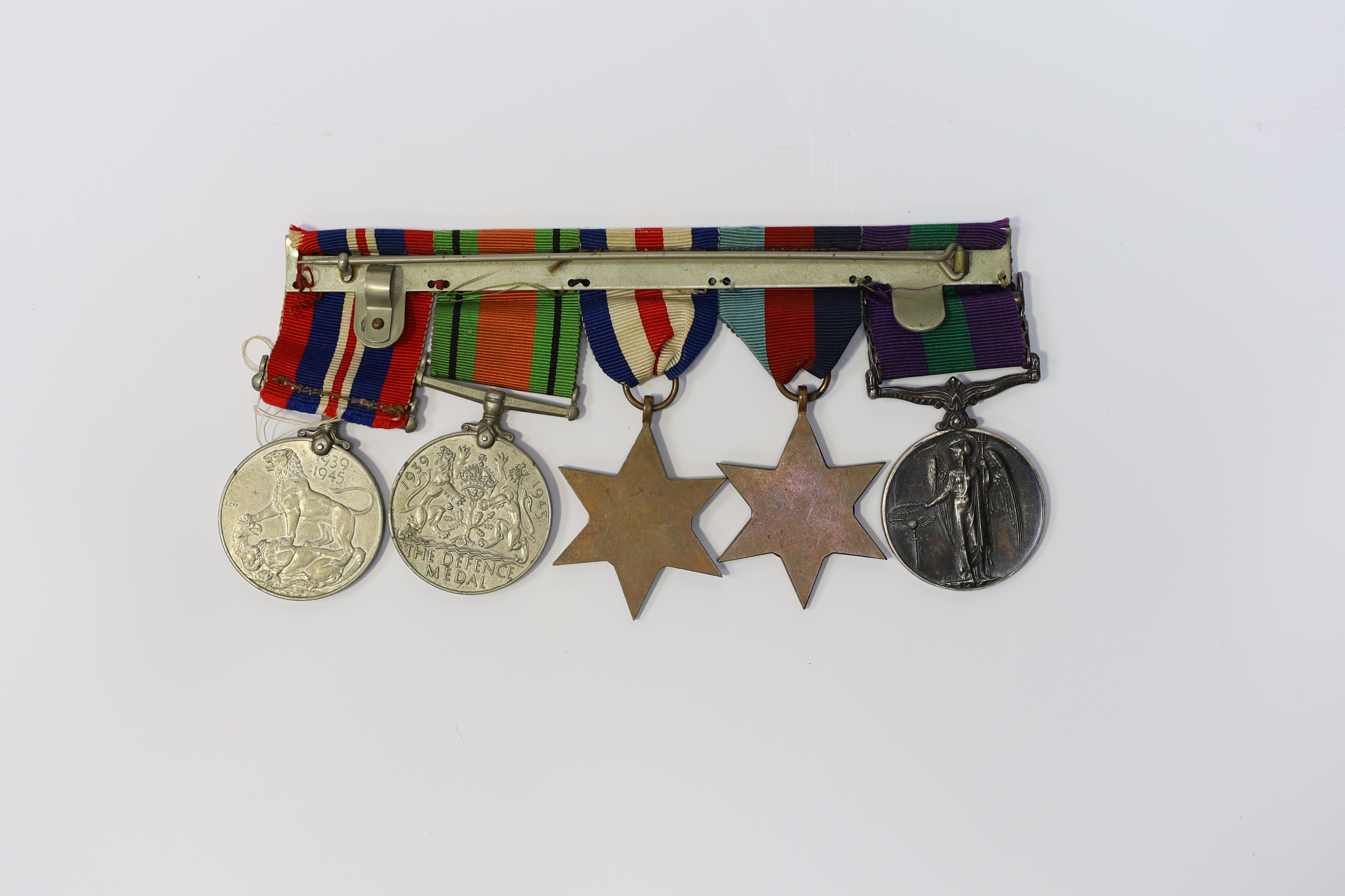 A WWII medal group awarded to Pte. J. Langridge S. Staff, comprising; a General Service Medal with two bars for Palestine and Palestine 1945-48, stamped to the edge with the recipient’s details, together with a 1939-45 S